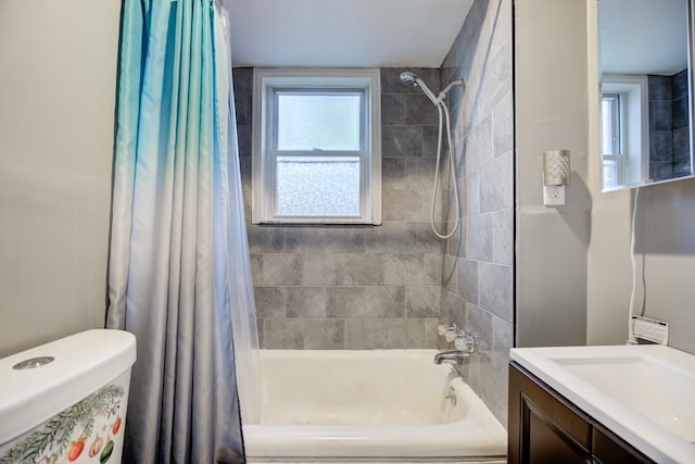 full bathroom with vanity, toilet, and shower / bath combo with shower curtain