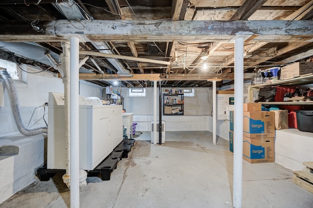 basement featuring washer / dryer and sink