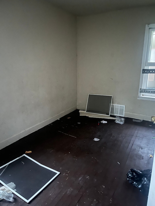 unfurnished room featuring hardwood / wood-style flooring