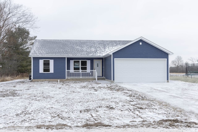 ranch-style house with covered porch, a trampoline, and a garage