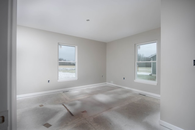 spare room featuring a wealth of natural light