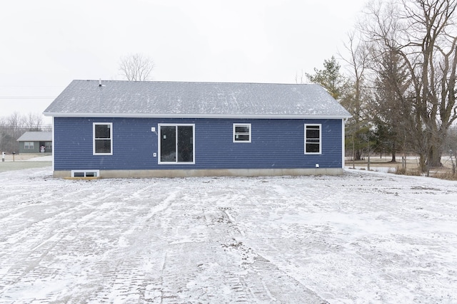 view of snow covered house