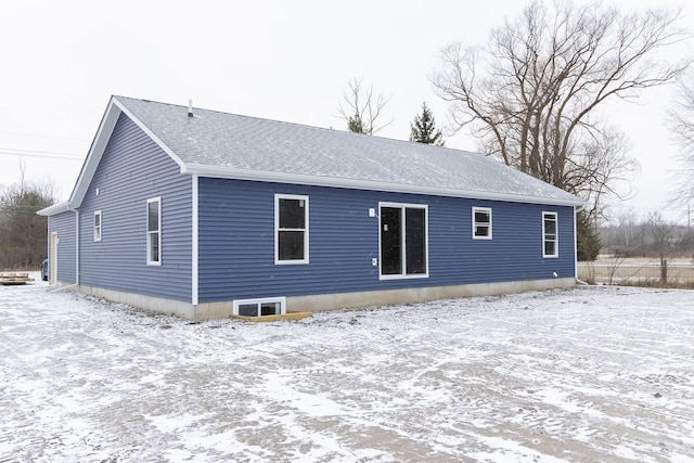 view of snow covered house