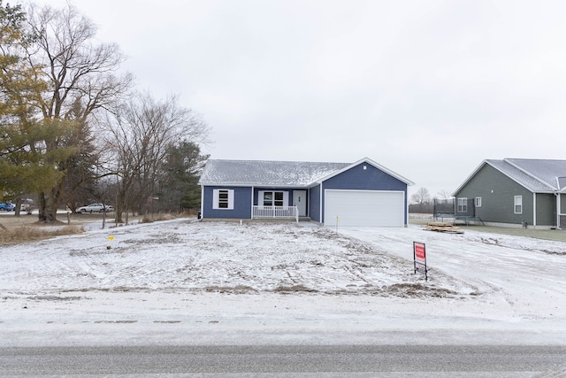 single story home with a garage, covered porch, and a trampoline