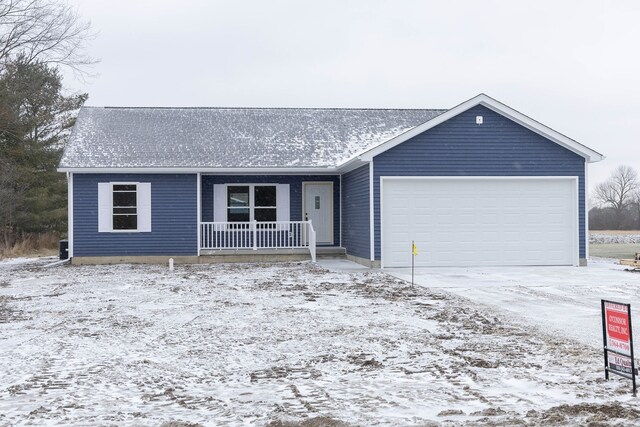 single story home with a porch and a garage