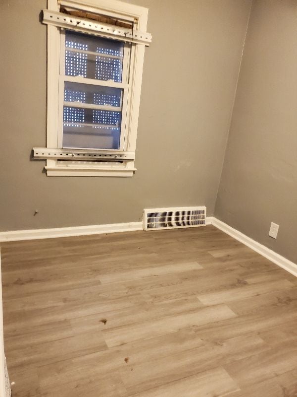 empty room featuring hardwood / wood-style floors