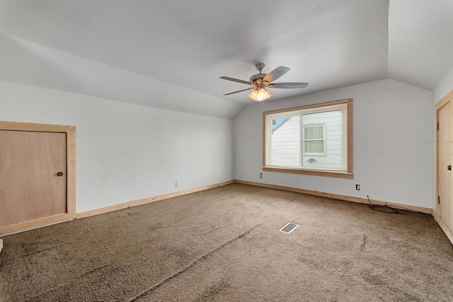 additional living space with carpet floors, vaulted ceiling, and ceiling fan