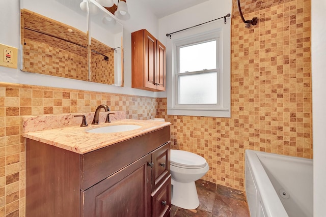 bathroom featuring vanity, toilet, and tile walls