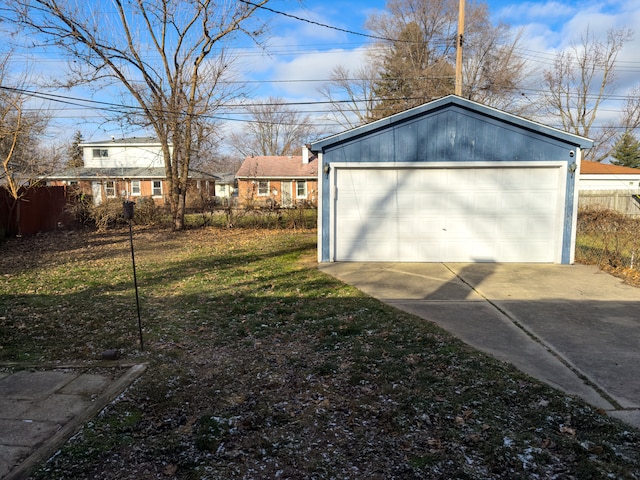 garage featuring a lawn