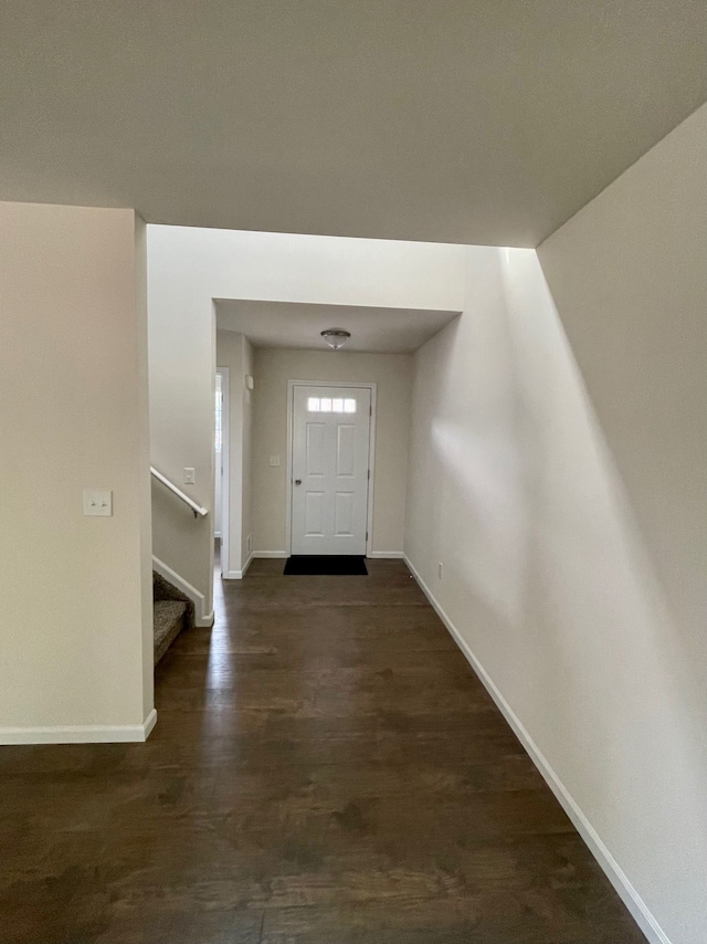 entrance foyer with dark hardwood / wood-style floors