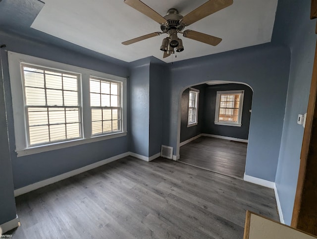 spare room featuring ceiling fan and wood-type flooring