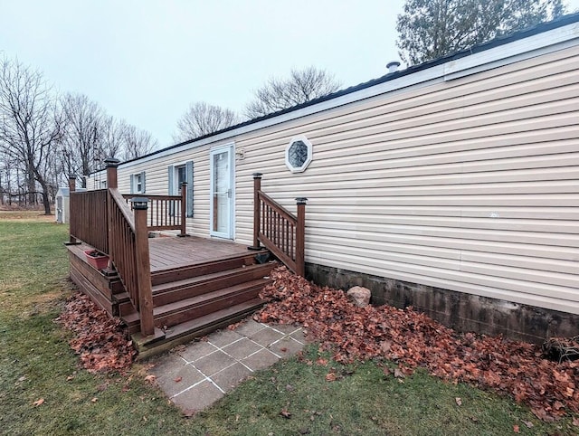 wooden terrace with a yard