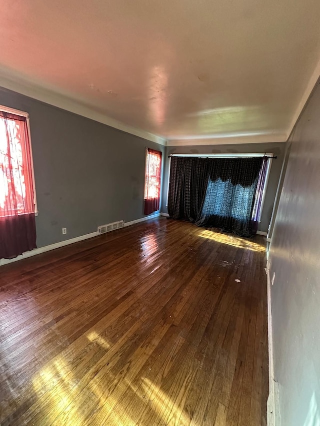 empty room featuring hardwood / wood-style flooring