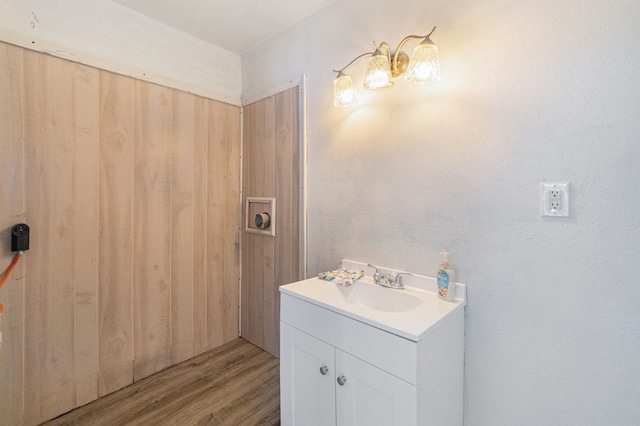 bathroom with hardwood / wood-style floors and vanity