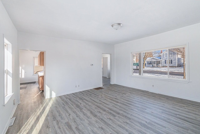 unfurnished room featuring dark hardwood / wood-style floors