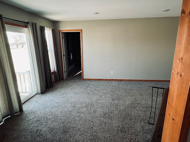 empty room with dark carpet