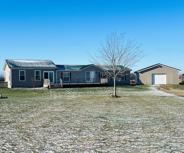 view of front of home with a garage and an outdoor structure