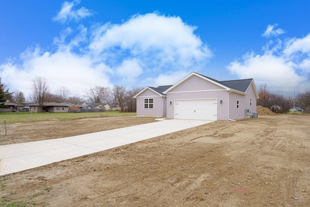 view of front of property with a garage and a front yard