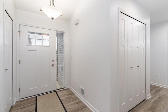 foyer with light wood-type flooring