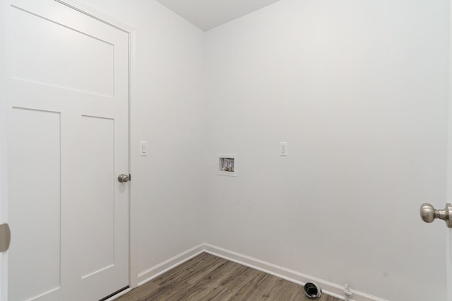 laundry room featuring dark hardwood / wood-style flooring and hookup for a washing machine