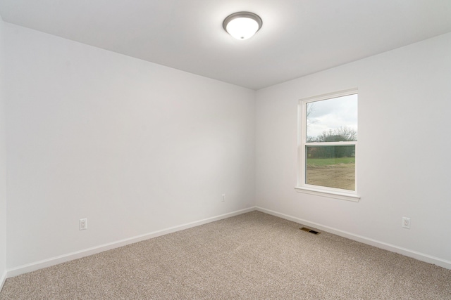 unfurnished room with carpet flooring