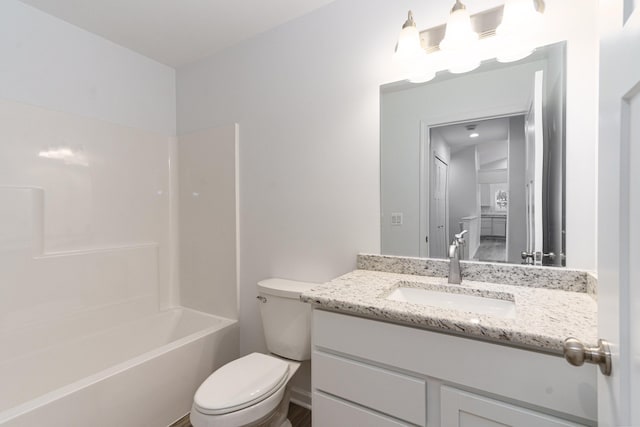 full bathroom featuring vanity, toilet, and  shower combination