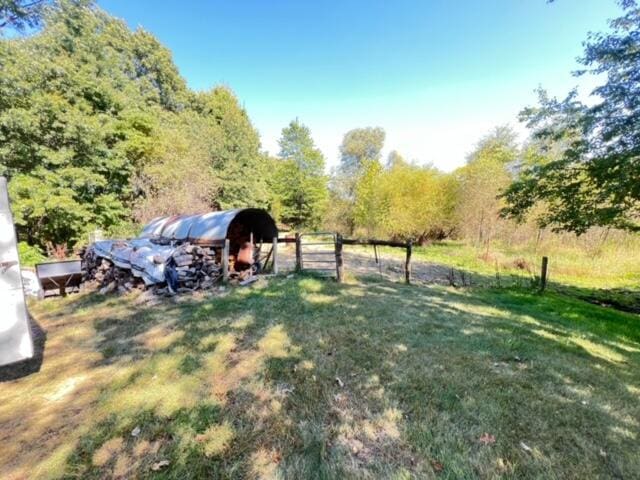 view of yard with a rural view