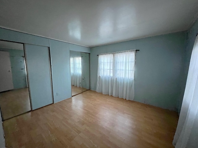 unfurnished bedroom with light hardwood / wood-style floors