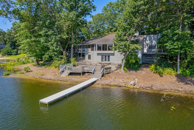 rear view of property with a deck with water view