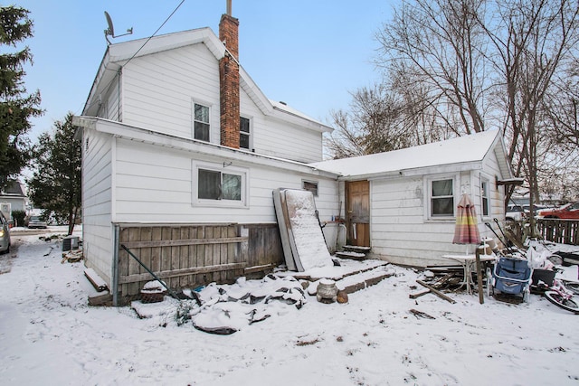 view of snow covered house