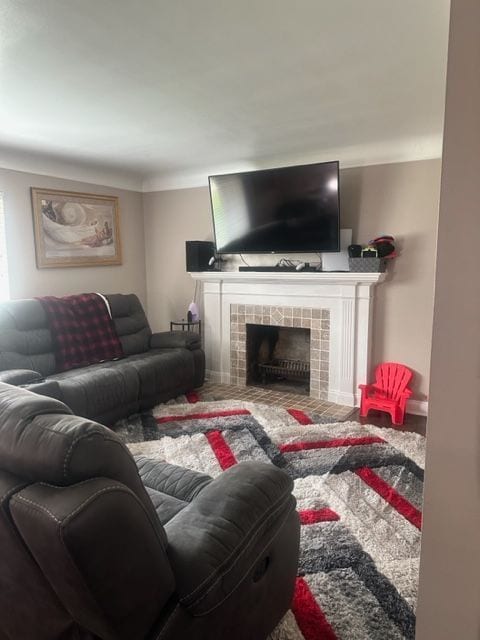 carpeted living room with a fireplace