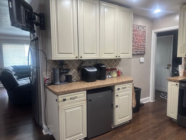 1220 Elford Ct, Grosse Pointe Woods, MI 48236 - kitchen with refrigerator, decorative backsplash, dark wood finished floors, and white cabinetry