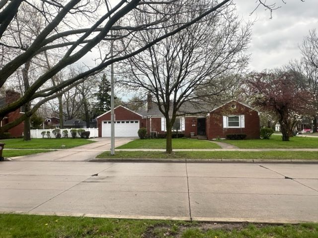 1220 Elford Ct, Grosse Pointe Woods, MI 48236 - view of front of house featuring concrete driveway and an attached garage