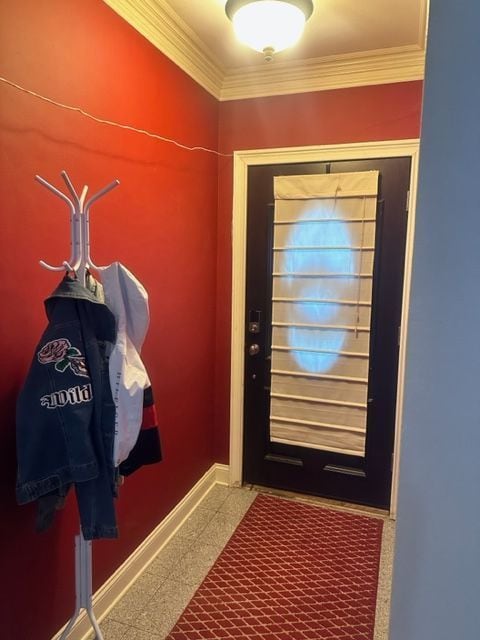 doorway to outside with crown molding