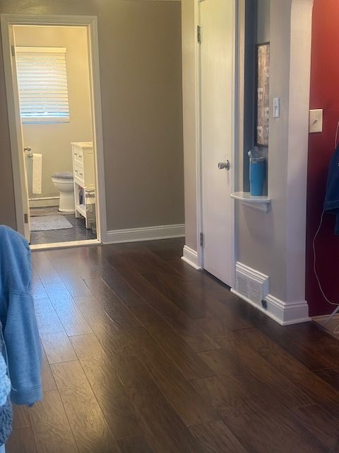 1220 Elford Ct, Grosse Pointe Woods, MI 48236 - bedroom featuring hardwood / wood-style flooring, arched walkways, and ensuite bath