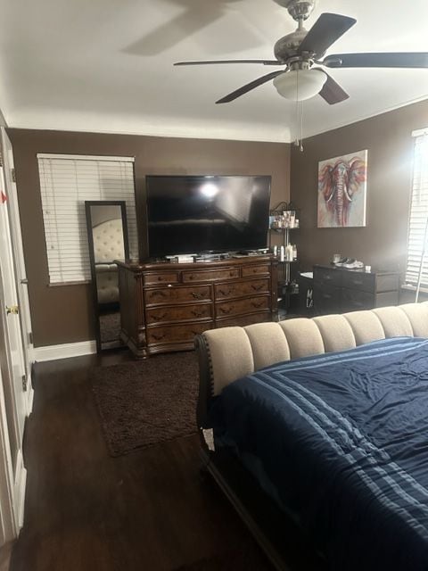 bedroom with ceiling fan and dark hardwood / wood-style floors