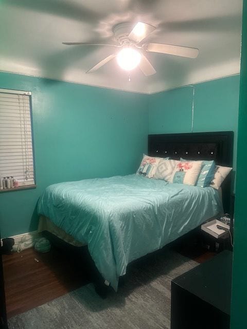 bedroom featuring hardwood / wood-style flooring and ceiling fan