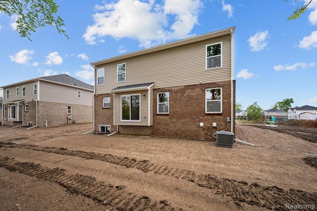 14213 Old Oak Trl, Van Buren, MI 48111 - back of property with brick siding and central air condition unit