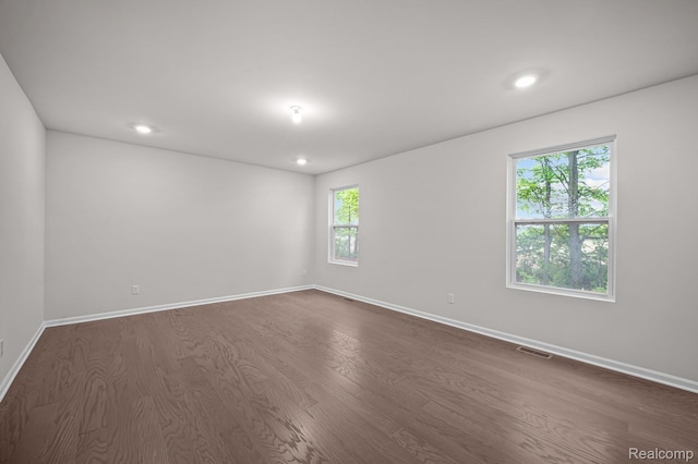 14213 Old Oak Trl, Van Buren, MI 48111 - empty room with dark wood-style flooring, baseboards, and recessed lighting