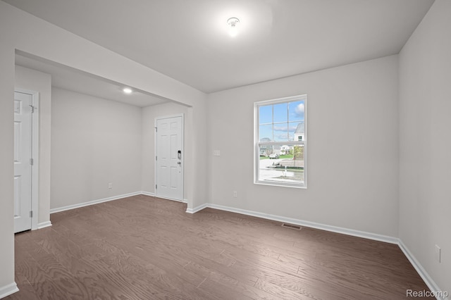 14213 Old Oak Trl, Van Buren, MI 48111 - unfurnished room featuring dark wood-style floors and baseboards