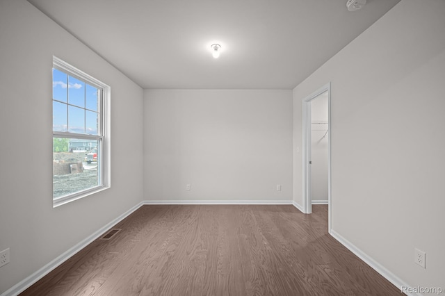 14213 Old Oak Trl, Van Buren, MI 48111 - spare room with dark wood-type flooring, baseboards, and a smoke detector
