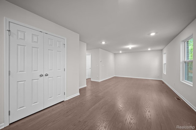 14213 Old Oak Trl, Van Buren, MI 48111 - unfurnished living room with dark wood-style floors, baseboards, and recessed lighting