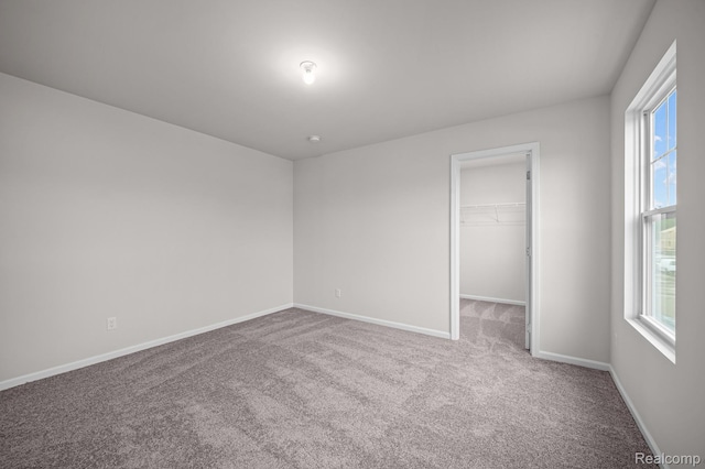 14213 Old Oak Trl, Van Buren, MI 48111 - carpeted empty room with healthy amount of natural light and baseboards