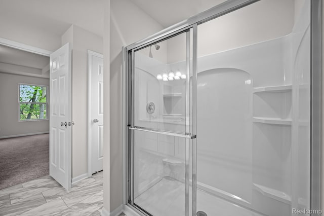 14213 Old Oak Trl, Van Buren, MI 48111 - bathroom with a shower stall, marble look tiles, and baseboards