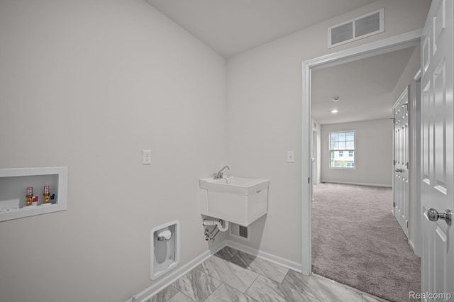 14213 Old Oak Trl, Van Buren, MI 48111 - laundry area with baseboards, washer hookup, light carpet, and light marble finish flooring