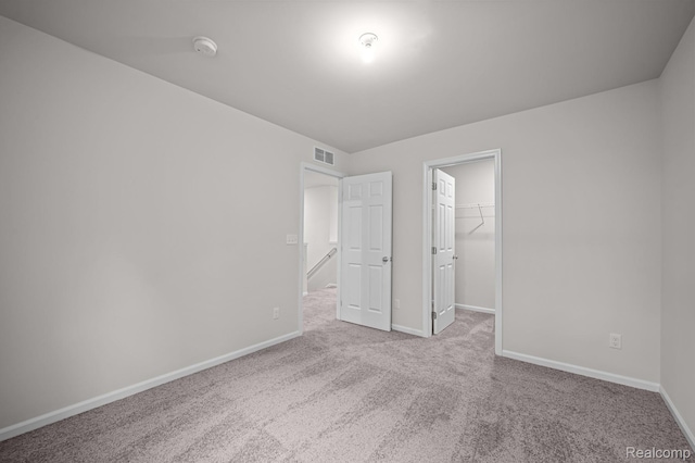 14213 Old Oak Trl, Van Buren, MI 48111 - unfurnished bedroom with carpet, baseboards, a spacious closet, and a closet