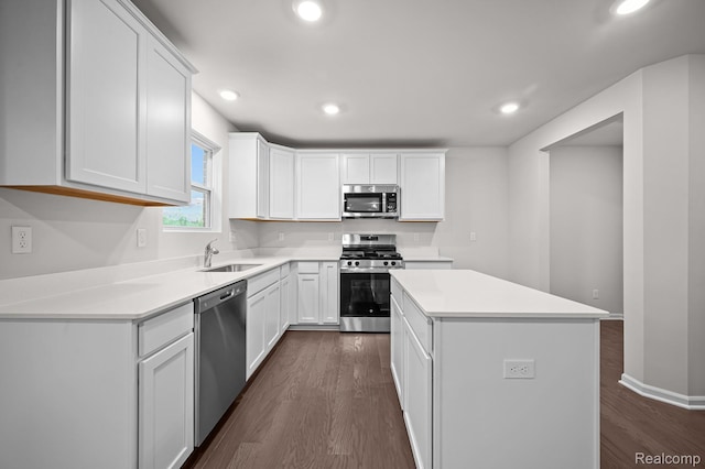 14213 Old Oak Trl, Van Buren, MI 48111 - kitchen with stainless steel appliances, a sink, dark wood finished floors, a center island, and recessed lighting