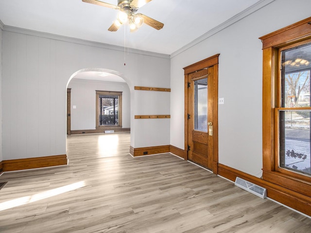 foyer entrance featuring ceiling fan, light hardwood / wood-style floors, and ornamental molding