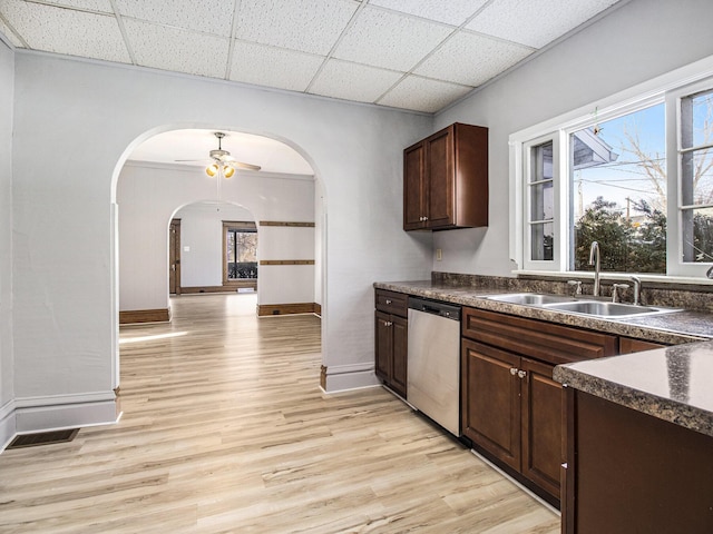 kitchen featuring light hardwood / wood-style floors, stainless steel dishwasher, plenty of natural light, and sink