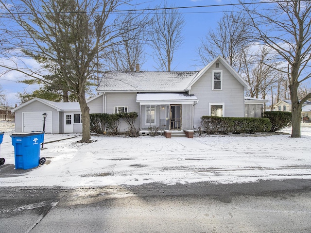 view of front property with a garage and an outdoor structure